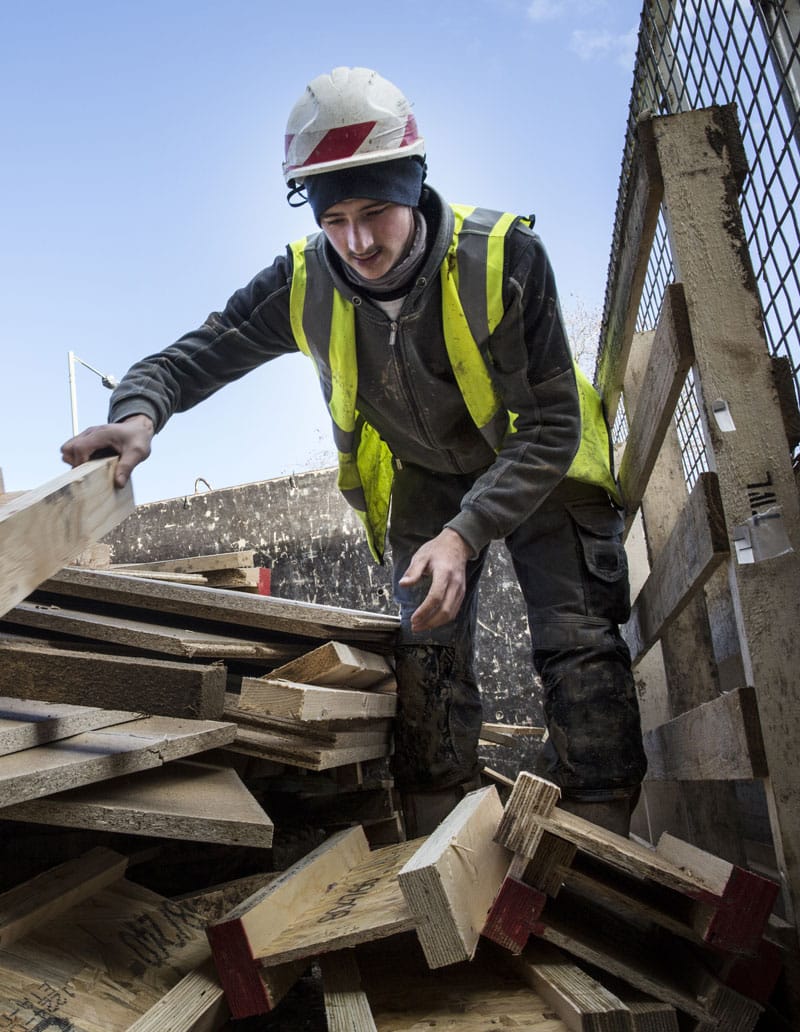 Environmental Sustainability worker in bin | ETC Alfred