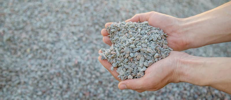 Residual material management gravel in hands | ETC Alfred